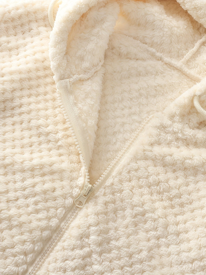 Beige Fleecejacke mit Reißverschluss, weiches Material, warme Winterkleidung, Kapuze.