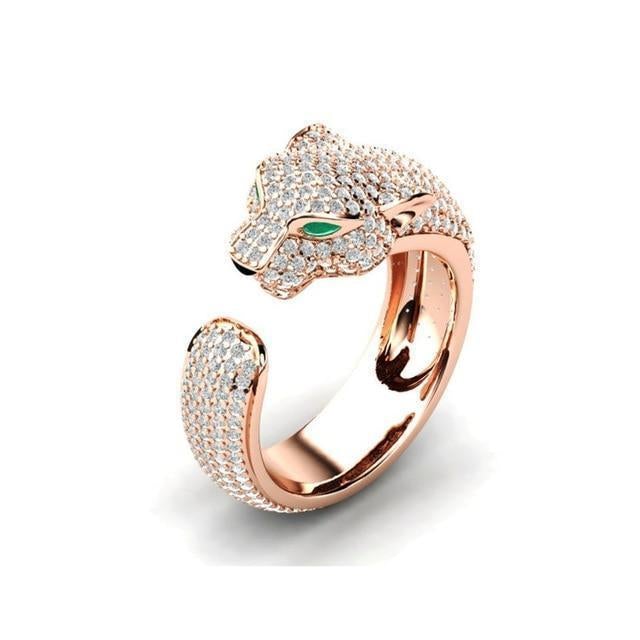 Goldener Panther-Ring mit Diamanten, Smaragd-Augen, luxuriöses Schmuckdesign.