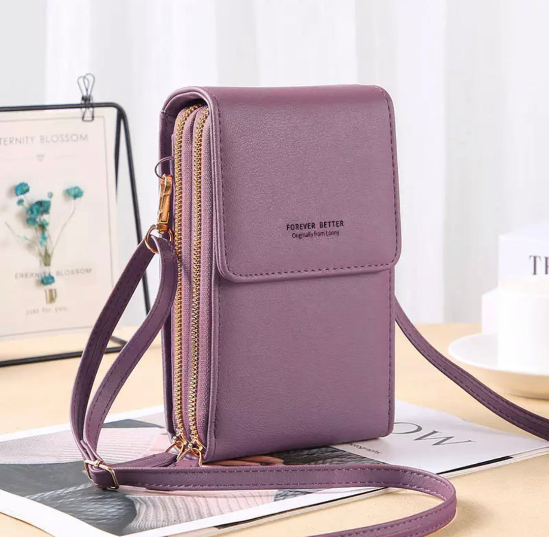 Lila Handy-Umhängetasche aus Leder mit Reißverschluss, modisch und praktisch für Damen.