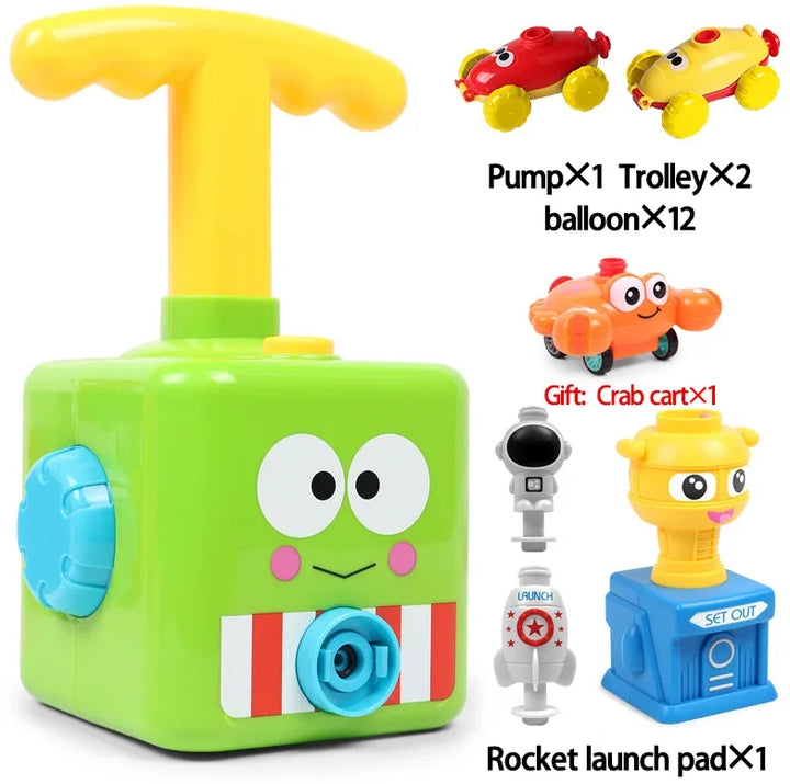 Grünes Spielzeug-Raketenstartset mit Pumpe, Autos und Krabbenwagen für Kinder.