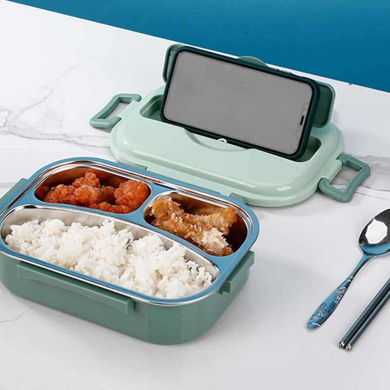 Grüne Bento-Box mit Handyhalter, Edelstahlfächern, Reis und Hähnchen, ideal für Mahlzeiten.
