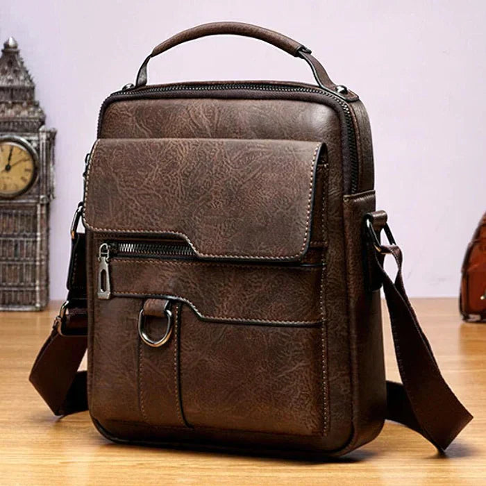 Braune Ledertasche, modern, stilvoll, mit Schulterriemen, ideal für Herren, Alltag, Büro.