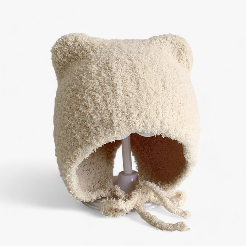 Beige Baby-Mütze mit Bärenohren, flauschig, warm, aus weichem Material, ideal für den Winter.