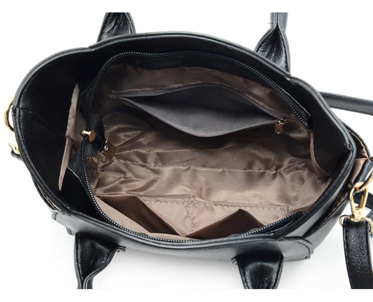 Schwarze Ledertasche mit goldenen Details, Innenfächer, Reißverschluss, Damenhandtasche.