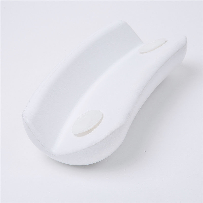 Weißer ergonomischer Türstopper aus Kunststoff für rutschfesten Halt auf glatten Böden.