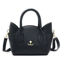 Schwarze Damenhandtasche aus Leder mit Katzendesign, goldene Details, abnehmbarer Schulterriemen.