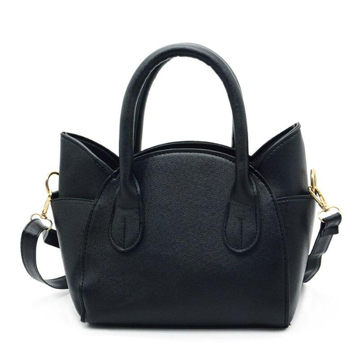 Schwarze Lederhandtasche mit goldenen Details, elegantes Design, Damenmode Accessoire.