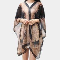 Schwarzer Damen-Poncho mit Paisley-Muster, transparent, elegant, modisches Accessoire.