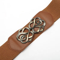 Brauner elastischer Gürtel mit dekorativer Metallschnalle, Damenmode-Accessoire.