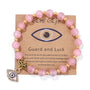 Rosa Perlenarmband mit türkischem Auge, Naturstein, Glücksbringer, goldene Akzente.