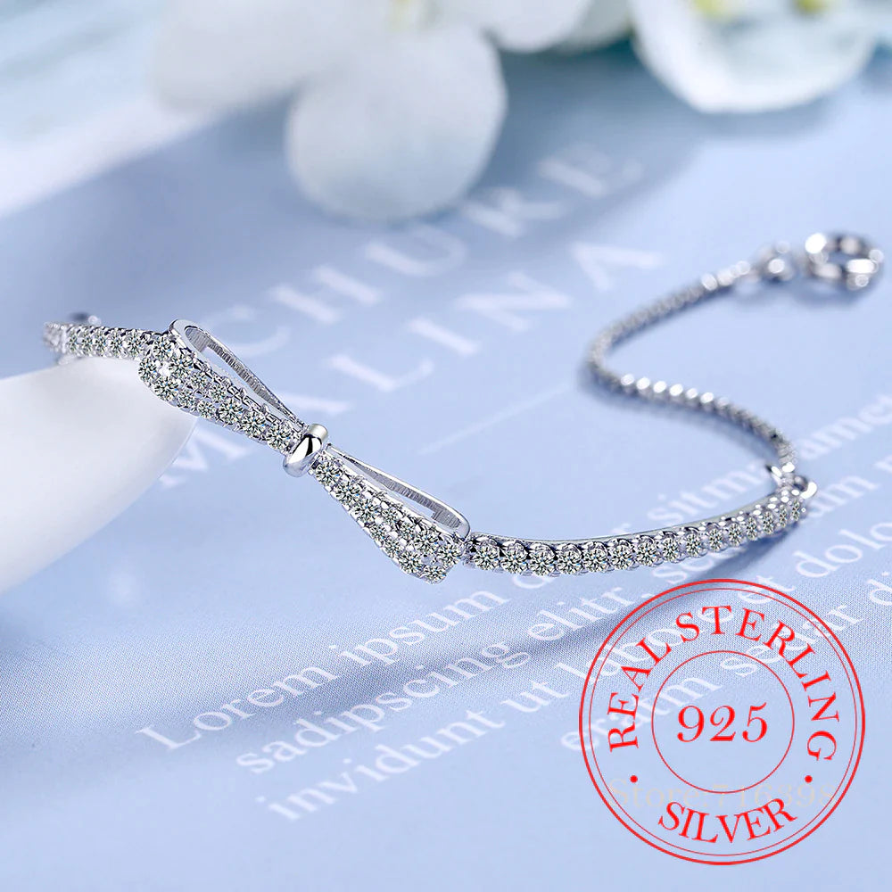 Silberarmband mit Schleife, Zirkonia, 925 Sterling Silber, Damen-Schmuck, elegant, funkelnd.