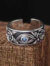 Silberring mit Auge und blauer Kristall, Rosenmuster, Herrenring, Schmuckdesign, Vintage-Stil.