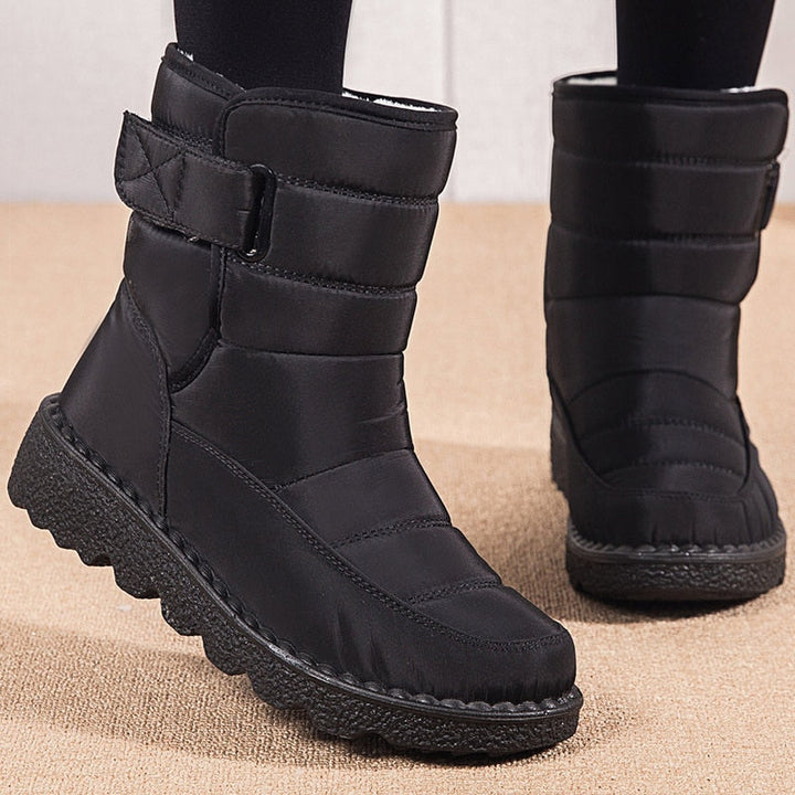 Schwarze Winterstiefel Damen, wasserdicht, gefüttert, rutschfeste Sohle, modisch, bequem.