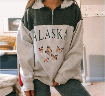 Grauer Alaska-Pullover mit Schmetterlingsmotiv, Damenmode, gemütlicher Freizeitlook.