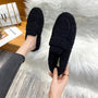 Schwarze Damen-Slipper aus Fleece, gemütlich, modisch, ideal für Herbst und Winter.