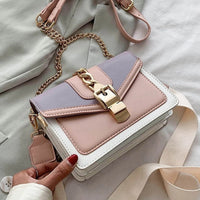 Damenhandtasche aus Leder, rosa und lila, mit Kettengurt und Schnalle, modisch und elegant.
