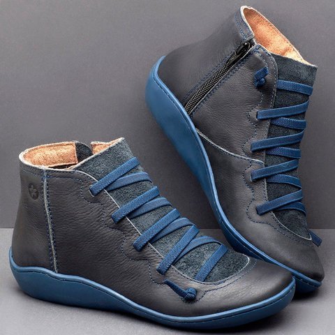 Dunkelblaue Leder-Sneaker mit Reißverschluss und blauen Schnürsenkeln für Damen.