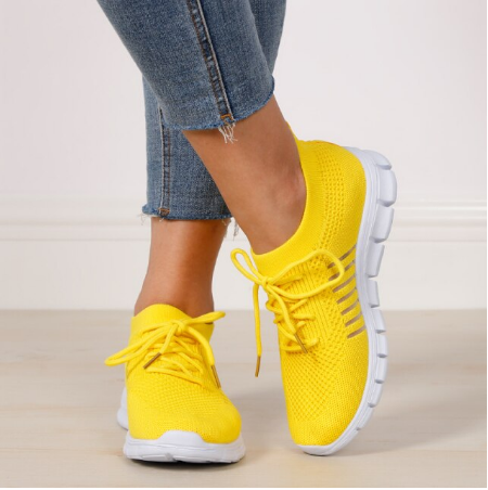 Gelbe Damen-Sneaker aus Mesh, bequem, atmungsaktiv, mit weißer Sohle, ideal für Freizeit.
