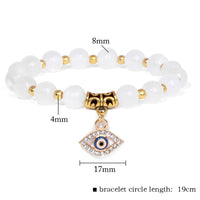 Weißes Perlenarmband mit türkischem Auge Anhänger, Naturstein, 19cm, Glücksbringer Schmuck.