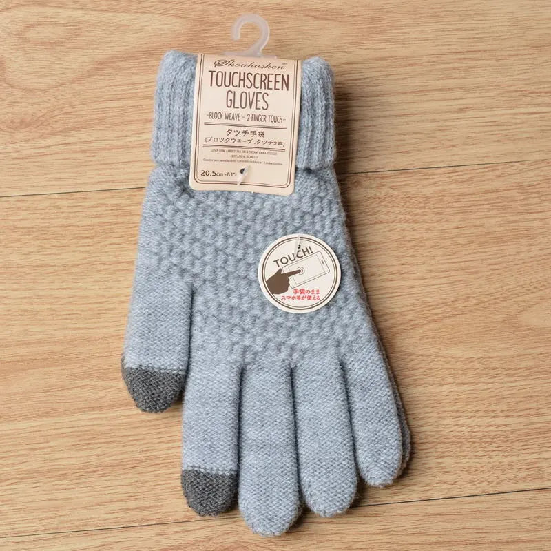 Graue Touchscreen-Handschuhe aus Wolle mit Strickmuster, ideal für Smartphones im Winter.