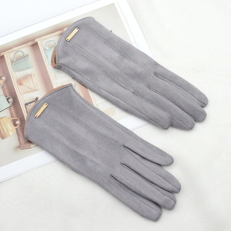 Graue Wildlederhandschuhe, elegant, Damenmode, Accessoire, stilvoll, warm, Winterbekleidung.