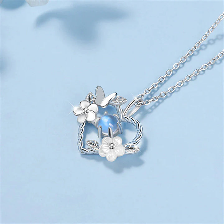 Silberne Herz-Halskette mit Blumen und Schmetterling, blauer Edelstein, Damen-Schmuck